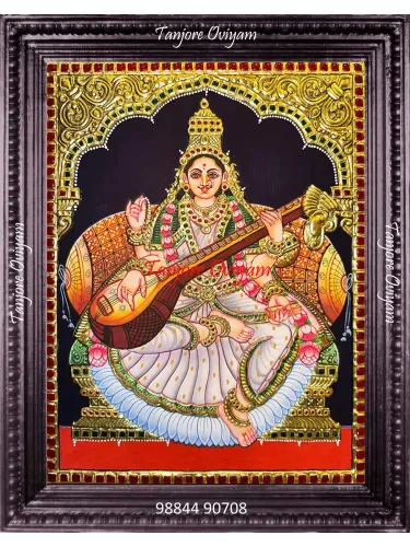 Handcrafted Saraswathi Devi Tanjore painting with veena, lotus and gold foil detailing